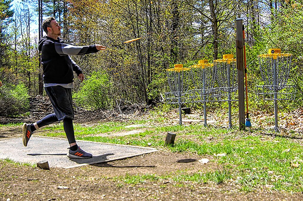 Scott White throwing a frisbee at Top O' The Hill Disc Golf in Canterbury on Thursday, May 6, 2021. MELISSA CURRAN