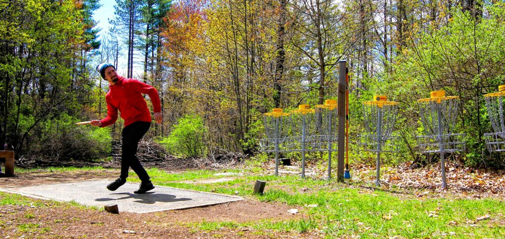 Michael Clark throwing a frisbee at Top O' The Hill Disc Golf in Canterbury on Thursday, May 6, 2021.  MELISSA CURRAN